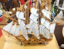 FOUR WOODEN MODEL SHIPS