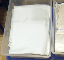 THREE BINS OF TABLE LINENS