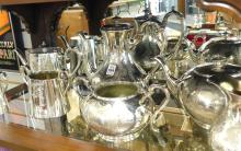 TWO SILVER PLATE TEA SETS