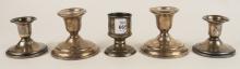 FIVE STERLING CANDLEHOLDERS