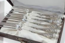 TIFFANY SPOONS, CASED FORKS AND KNIFE RESTS