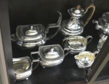 THREE SILVER PLATE TEA SETS