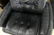 STRESSLESS BLACK LEATHER RECLINER AND FOOTSTOOL