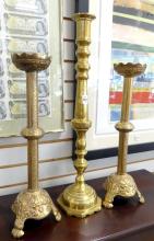 THREE LARGE BRASS CANDLESTICKS