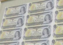 FRAMED UNCUT SHEET OF CANADIAN $1 BILLS