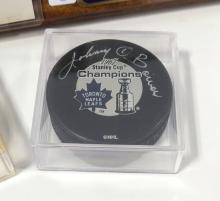 TWO AUTOGRAPHED PUCKS AND PLAQUE