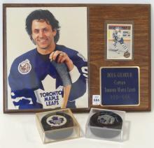 TWO AUTOGRAPHED PUCKS AND PLAQUE