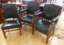 THREE GREEN LEATHER CHAIRS