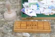 STAMPS, CRIBBAGE BOARD AND BUTTER PRESS