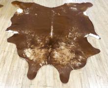 TWO COWHIDE RUGS