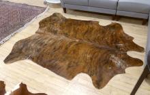 TWO COWHIDE RUGS