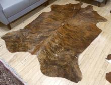 TWO COWHIDE RUGS