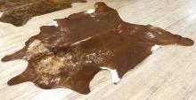 TWO COWHIDE RUGS