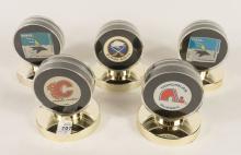 FIVE HOCKEY PUCKS