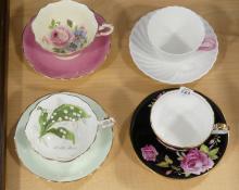 FOUR CUPS AND SAUCERS