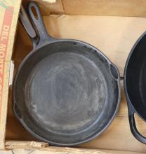 FOUR CAST IRON FRYING PANS AND POT