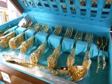 GOLD-PLATED FLATWARE IN CANTEEN