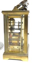 CARRIAGE CLOCK AND CANDLESTICKS