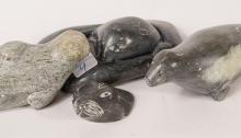 FOUR INUIT SOAPSTONE "SEAL" CARVINGS
