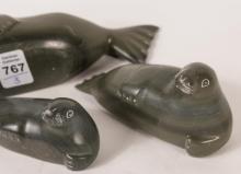 THREE INUIT "SEAL" SOAPSTONE CARVINGS