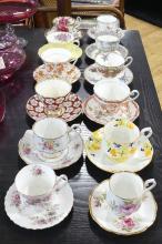 TWELVE CUPS AND SAUCERS