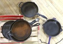 FIVE CAST IRON FRYING PANS AND CHILD'S SLED