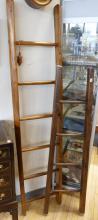 TWO DECORATIVE WOODEN LADDERS