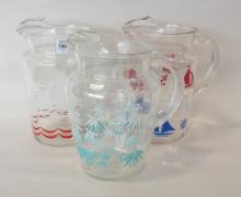 THREE MID-20TH CENTURY GLASS WATER PITCHERS