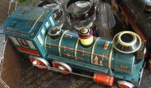 TWO VINTAGE JAPANESE TIN TRAIN TOYS