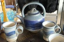 FOUR-PIECE TEA SET AND TEAPOT