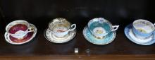 SEVEN ENGLISH CUPS AND SAUCERS