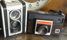 TWO MANTEL CLOCKS AND TWO CAMERAS