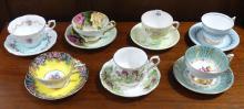 SEVEN ENGLISH CUPS AND SAUCERS