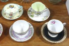 NINE CUPS AND SAUCERS