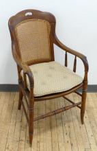 CANED OAK ARMCHAIR