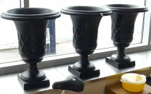 SET OF THREE CAST IRON GARDEN URNS