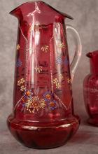 FOUR ANTIQUE CRANBERRY GLASS PITCHERS