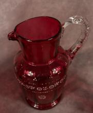 FOUR ANTIQUE CRANBERRY GLASS PITCHERS