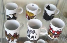SET OF TWELVE MARC TETRO COFFEE MUGS