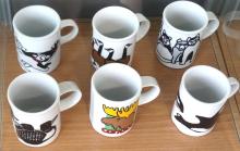 SET OF TWELVE MARC TETRO COFFEE MUGS