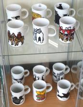 SET OF TWELVE MARC TETRO COFFEE MUGS