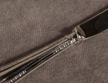 SIX STERLING HANDLED BREAD AND BUTTER KNIVES