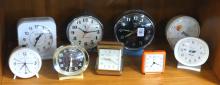NINE ALARM CLOCKS