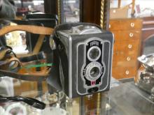 TWO CAMERAS AND BINOCULARS